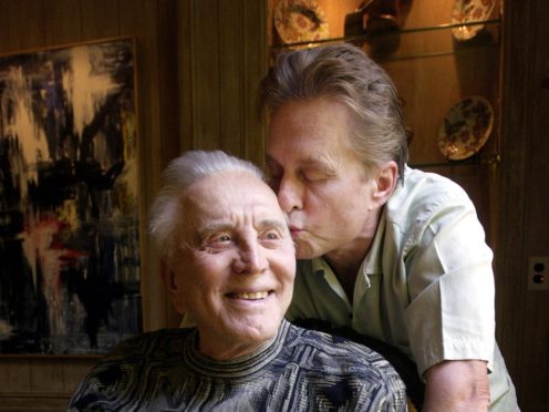 Michael Douglas was a devoted son to his father Kirk, who has died aged 103 (AP Photo/Chris Pizzello, File)