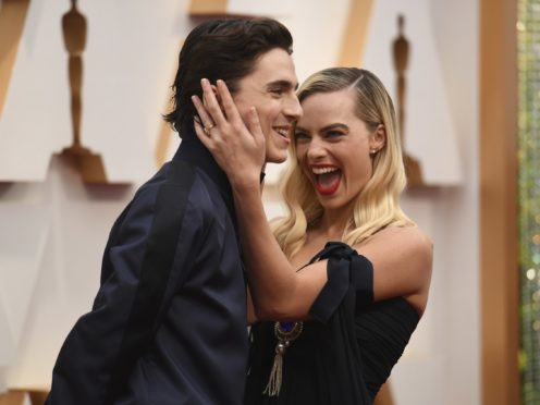 Timothee Chalamet photobombs Margot Robbie on Oscars red carpet (Richard Shotwell/AP)