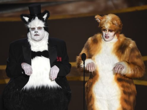 James Corden, left, and Rebel Wilson present the award for best visual effects at the Oscars (Chris Pizzello/AP)