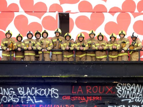 Firefighters gather outside Koko where they were thanked for helping to save the famous London music venue (David Parry/PA)