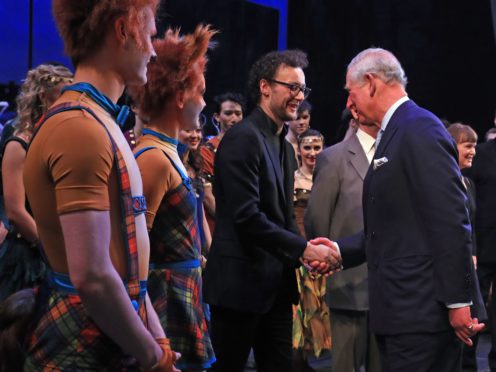 The Prince of Wales shakes hands with choreographer Liam Scarlett as he attends the world premiere of the ballet, The Cunning Little Vixen (Gareth Fuller/PA)