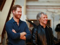 The Duke of Sussex meets Jon Bon Jovi (Hannah McKay/PA)