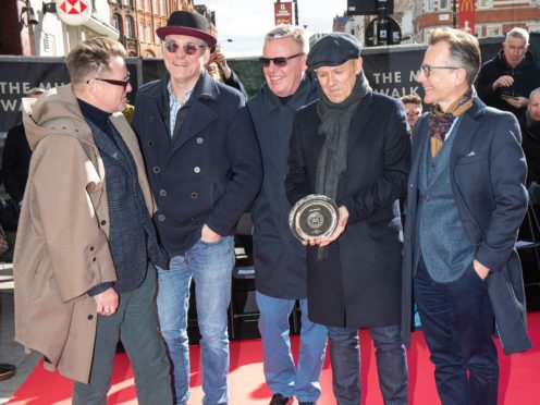 Members of Madness during the unveiling of a stone to honour the band at the Music Walk of Fame in Camden (Aaron Chown/PA)