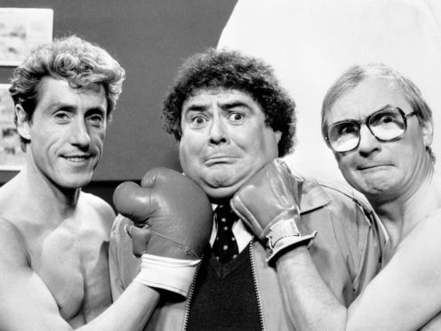 Eddie Large (centre) with Roger Daltrey (left) and comedy partner Syd Little in 1986 (PA)