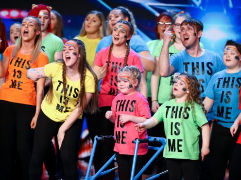 Ella (front centre) performing with the choir (Syco/Thames/ITV)