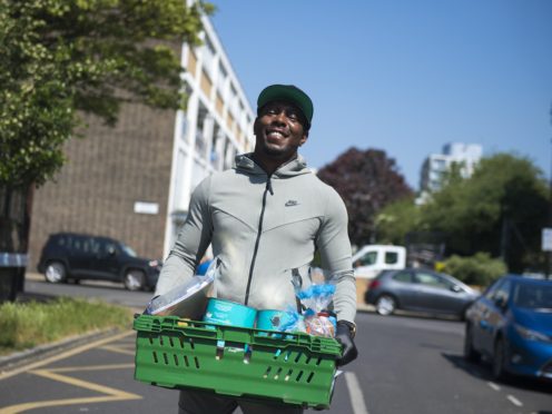The rapper helped distribute the food parcels at a primary school in Poplar, east London (Ben Stevens/PA)