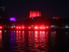 The National Theatre and the South Bank is lit up in red (Yui Mok/PA)