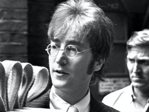 John Lennon arriving at EMI Studios (PA)