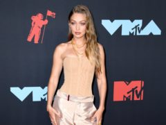New mother Gigi Hadid shared a throwback picture of her baby bump as she wished younger sister Bella a happy birthday (PA)