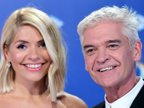 Phillip Schofield has heaped praise on his co-host Holly Willoughby (Ian West/PA)