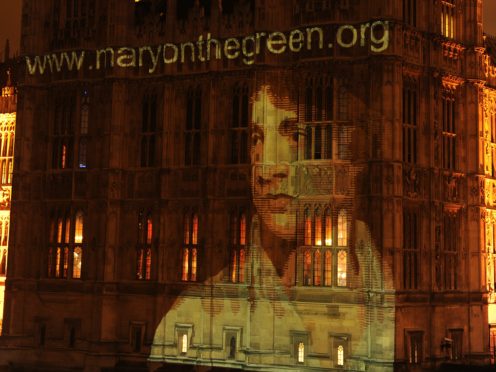 An image of Mary Wollstonecraft is projected on to the Houses of Parliament (Georgie Gillard/PA)