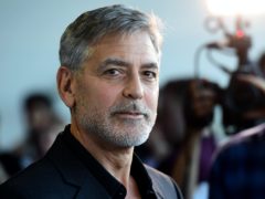 George Clooney has confirmed he once gave 14 of his closest friends a million dollars (£754,000) each in cash (Ian West/PA)