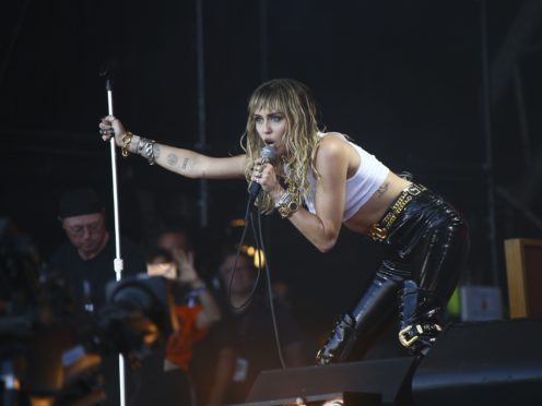 Miley Cyrus and Dua Lipa hit the road in the steamy 1980s-inspired music video for Prisoner (Joel C Ryan/Invision/AP, File)