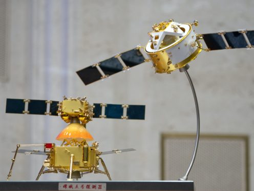 A model of China’s Chang’e 5 lunar orbiter and lander are displayed before a press conference at the State Council Information Office in Beijing (Mark Schiefelbein/AP)