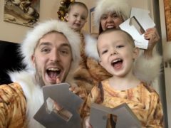 Mark and Roxanne Hoyle with their children, Kobe and Phoenix, celebrating a third Xmas number one (Official Charts Company).
