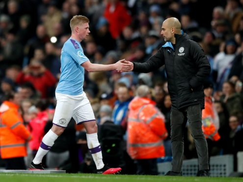 Manchester City manager Pep Guardiola is confident Kevin De Bruyne will commit his long-term future to the club (Martin Rickett/PA)