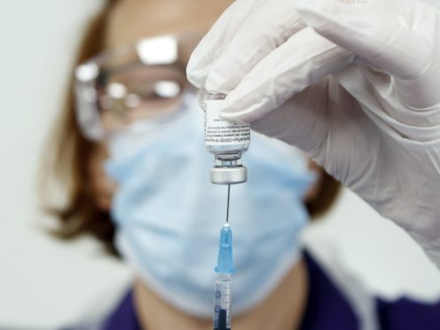 A nurse prepares the Pfizer/BioNTech vaccine (Danny Lawson/PA)