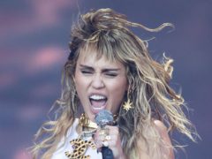 An emotional Miley Cyrus fought back tears during her star-studded pre-Super Bowl performance (Aaron Chown/PA)