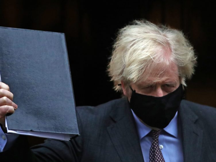 Prime Minister Boris Johnson leaving 10 Downing Street to give his speech to Parliament where he will set out the road map for easing coronavirus restrictions across England (Aaron Chown/PA)