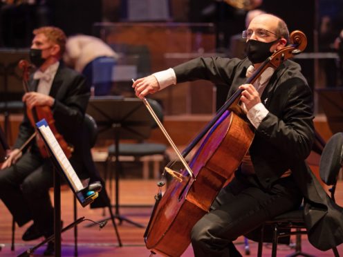 Members of the Bournemouth Symphony Orchestra tune their instruments (Andrew Matthews/PA)