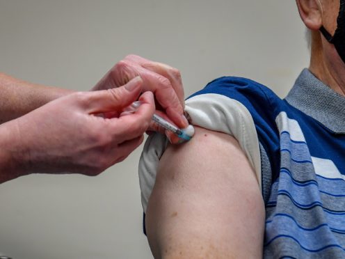 File photo dated 04/01/21 of person receiving a Covid-19 vaccine. Vaccinated people should be allowed to visit one another and there is no real science stopping this from happening, an expert has said. Issue date: Friday March 26, 2021.
