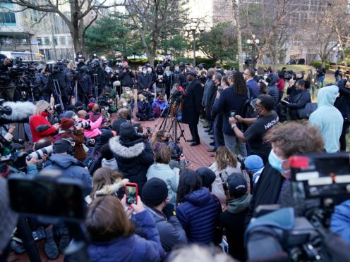 George Floyd family lawyer Ben Crump addresses media along with other lawyers and members of George Floyd’s family outside the Hennepin County Government Centre (Jim Mone/AP)