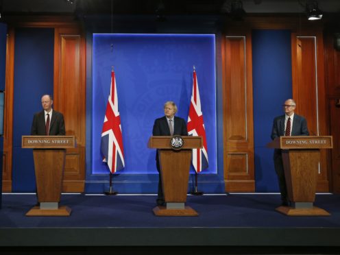 (left to right) England’s chief medical officer Professor Chris Whitty, Prime Minister Boris Johnson and England’s chief scientific adviser Sir Patrick Vallance in the new briefing room (Hollie Adams/PA)