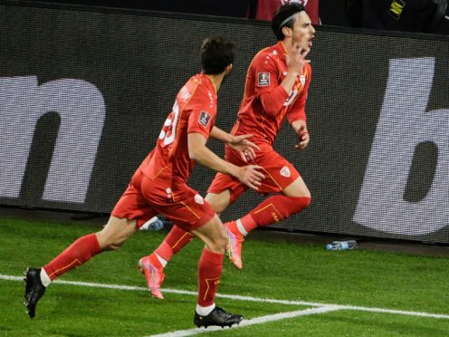 North Macedonia’s Eljif Elmas, right, celebrates his late winner in Germany (Thilo Schmuelgen/Pool via AP)