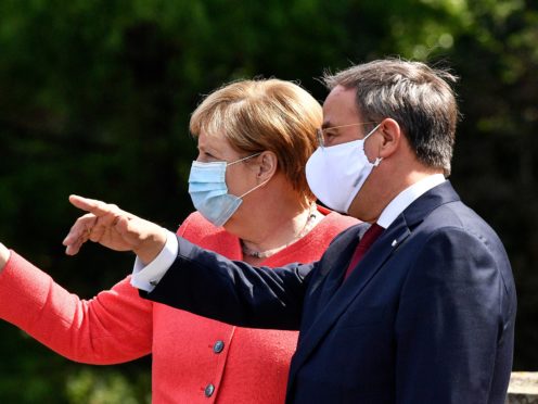 German chancellor Angela Merkel, left, and her successor as chairman of the Christian Democratic Union Armin Laschet (Martin Meissner/AP)