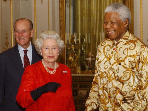 The Queen and Duke of Edinburgh meet former South African President Nelson Mandela (Kirsty Wigglesworth/PA)