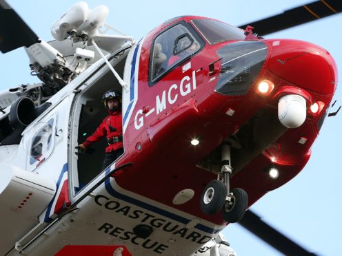 A Coastguard helicopter was involved in the rescue (Andrew Milligan/PA)