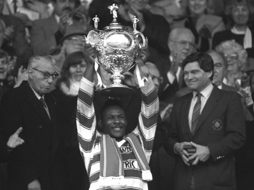 Wigan captain Ellery Hanley lifted the Challenge Cup three times a row (PA Archive).
