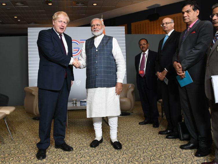 Boris Johnson and Narendra Modi for at the G7 summit in Biarritz, France.