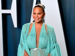 Chrissy Teigen revealed she plans to pay tribute to her late son by planting a tree at her home and putting his ashes in the soil (Ian West/PA)
