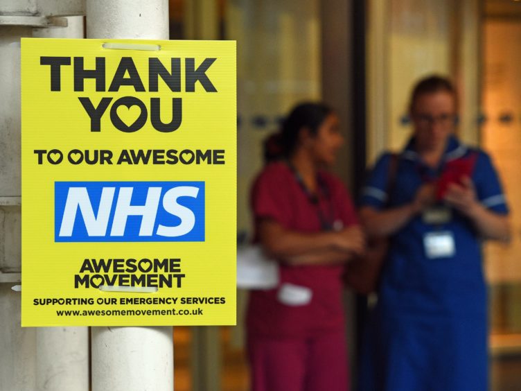 Visas will be extended for thousands of frontline health and care workers (Kirsty O’Connor/PA Archive)