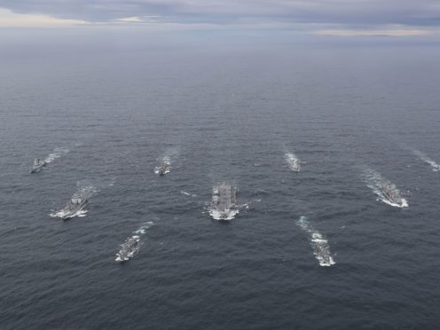 HMS Queen Elizabeth, centre, at sea (LPhot Belinda Alker/MoD/PA)