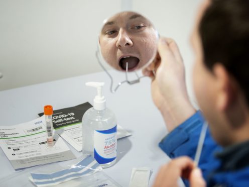 People are being urged to take part in coronavirus testing (Jane Barlow/PA)