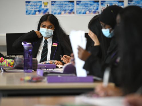 Children wearing facemasks during a lesson at Hounslow Kingsley Academy in West London (Kirsty O’Connor/PA)