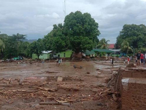 Residents inspect the damage at a village hit by flash flood in East Flores, Indonesia (AP/Ola Adonara)