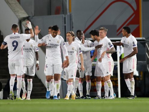 Real Madrid celebrate during their first-leg win over Liverpool (Isabel Infantes/PA)