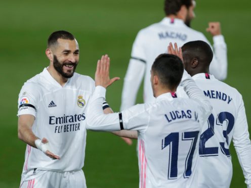 Karim Benzema, left, celebrates his goal with his Real Madrid team-mates (Manu Fernandez/AP)