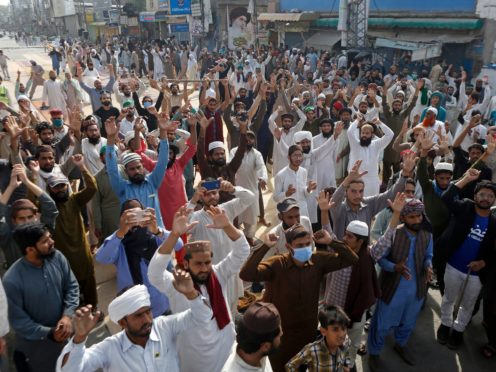 Supporters of Tehreek-e-Labiak Pakistan, a radical Islamist political party, chant slogans during a protest against the arrest of their party leader, Saad Rizvi, in Lahore, Pakistan (K.M. Chaudary/AP)