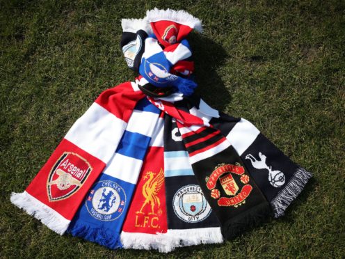 A selection of scarves pictured at Hackney Marshes, London, of the English soccer Premier League teams (left-right) Arsenal, Chelsea, Liverpool, Manchester City, Manchester United and Tottenham Hotspur, who announced in a joint statement they are to join a new European Super League (Yui Mok/PA)
