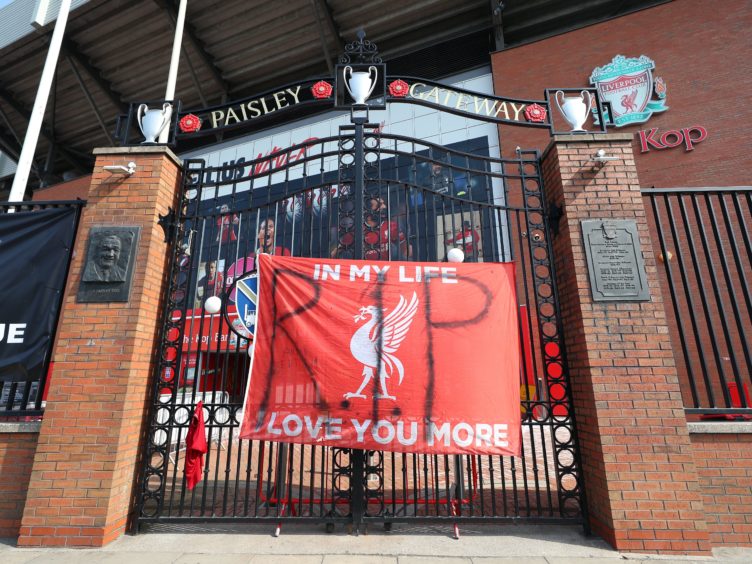 Banners outside Liverpool’s Anfield Stadium protesting against the club’s decision to join the European Super League (Peter Byrne/PA)