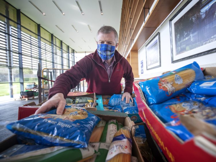 Scottish Liberal Democrat leader Willie Rennie visits a food bank at Gogarburn Conference Centre, Edinburgh, as he sets out plans for adult social care during campaigning for the Scottish Parliamentary election (Jane Barlow/PA)