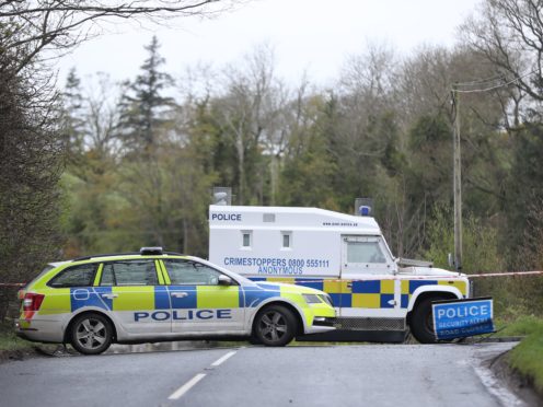PSNI vehicles blocking a road during the security operation (Niall Carson/PA)