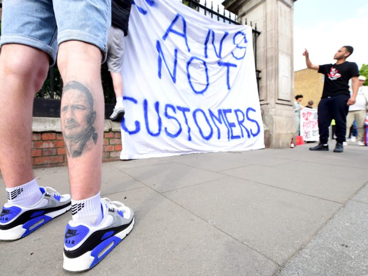 Fans protest against Chelsea’s involvement in the new European Super League (Ian West/PA)
