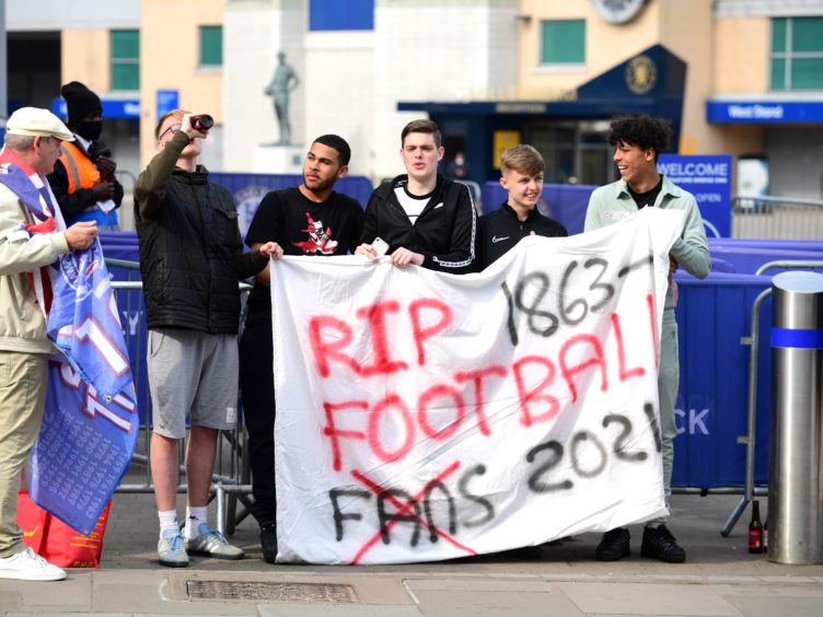 Fans protest against Chelsea’s involvement in the new European Super League (Ian West/PA)