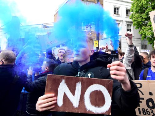 Fans protest against Chelsea’s involvement in the new European Super League (Ian West/PA)