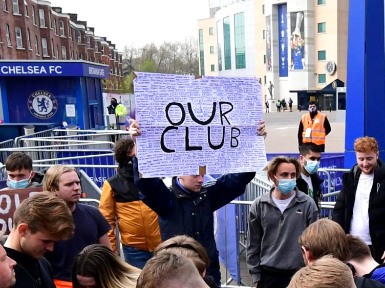 Fans protest against Chelsea’s involvement in the new European Super League outside Stamford Bridge (Ian West/PA)